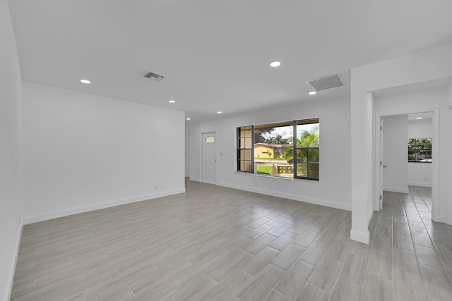 unfurnished room with light hardwood / wood-style flooring