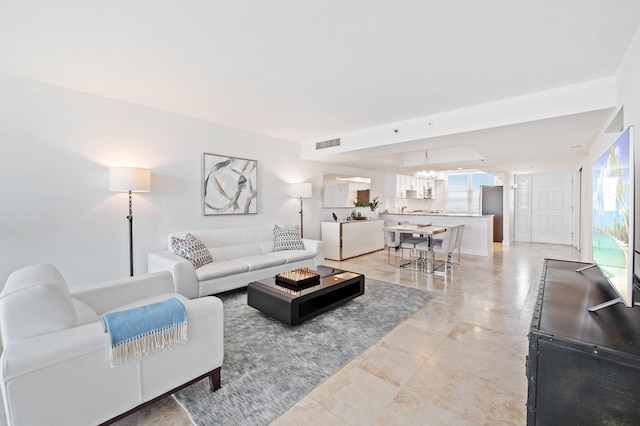 living room featuring an inviting chandelier