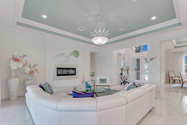 kitchen with backsplash, light stone counters, stainless steel appliances, crown molding, and a center island