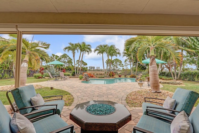 view of patio / terrace featuring pool water feature and ceiling fan