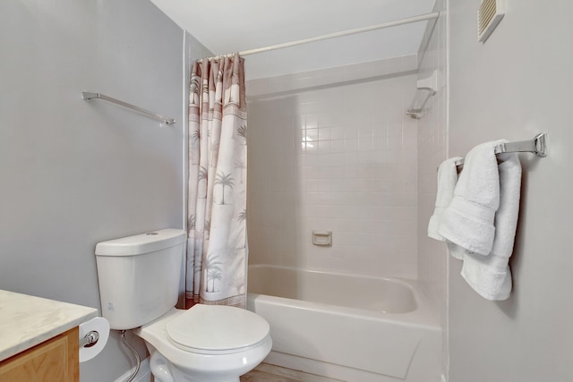 full bathroom featuring shower / tub combo with curtain, vanity, and toilet