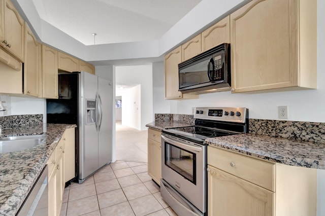 kitchen with light stone counters, sink, stainless steel appliances, light brown cabinets, and light tile patterned floors