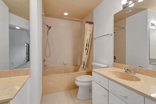 full bathroom featuring vanity, tile patterned floors, toilet, and shower / bath combo