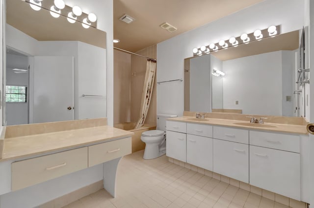 full bathroom with vanity, shower / bath combo with shower curtain, toilet, and tile patterned floors