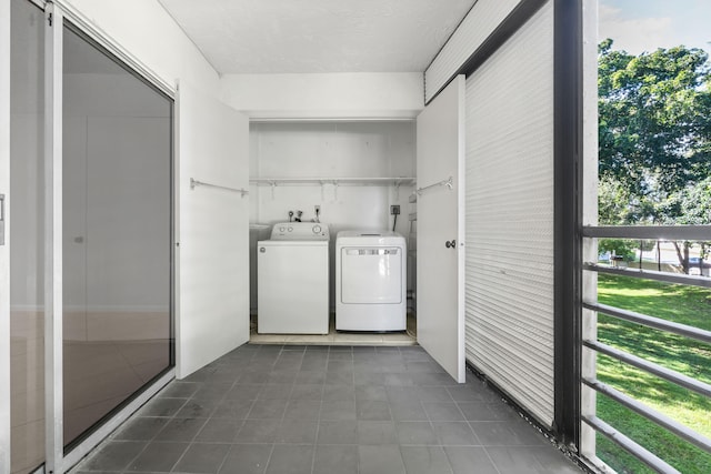 laundry area with washing machine and clothes dryer