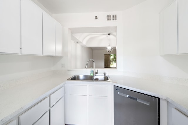 kitchen with pendant lighting, dishwasher, sink, and white cabinetry