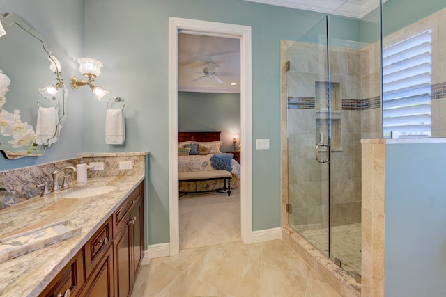 bathroom with ornamental molding, vanity, ceiling fan, and a shower with shower door