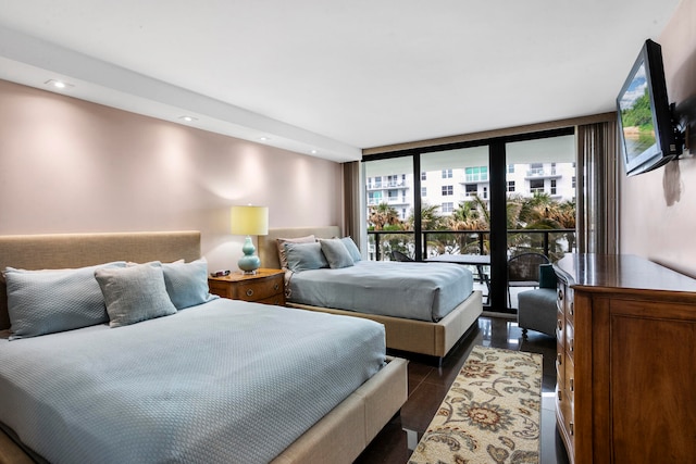 tiled bedroom with floor to ceiling windows and access to exterior