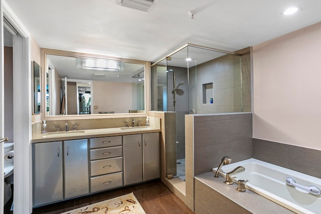 bathroom with vanity and plus walk in shower