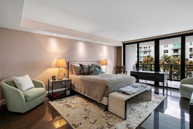 bedroom with tile patterned flooring, access to outside, and floor to ceiling windows