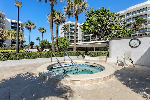 view of pool featuring a hot tub