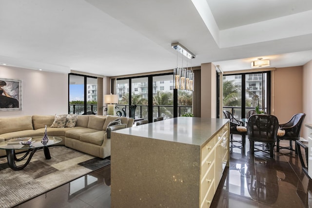 kitchen with a center island, expansive windows, and pendant lighting