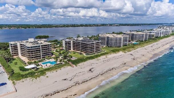 bird's eye view with a view of the beach and a water view