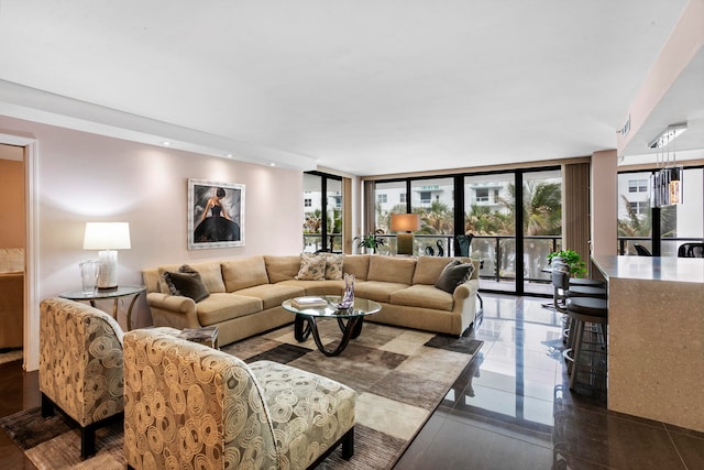 living room featuring floor to ceiling windows