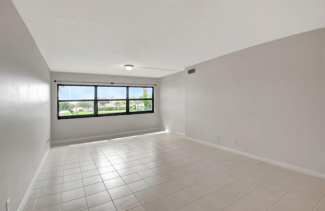 view of tiled spare room