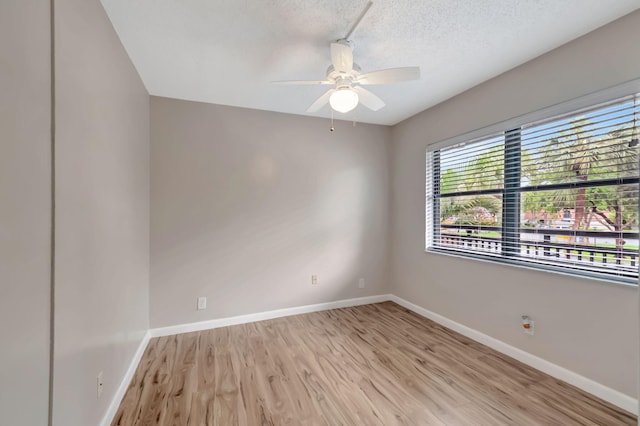 unfurnished room featuring ceiling fan, a textured ceiling, and light hardwood / wood-style floors