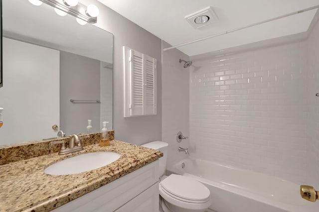 full bathroom with vanity, toilet, and tiled shower / bath combo