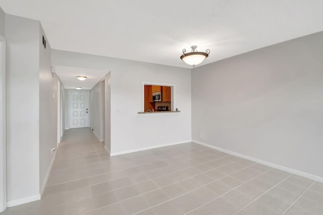 spare room with light tile patterned floors