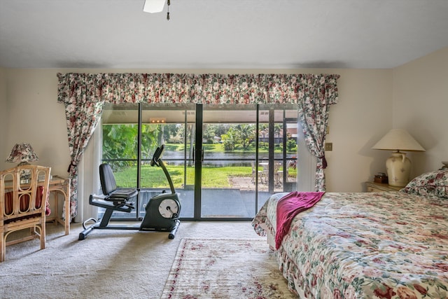 bedroom featuring access to outside, carpet flooring, and ceiling fan