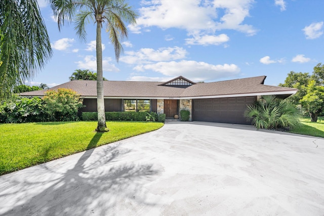 ranch-style house with a garage and a front lawn