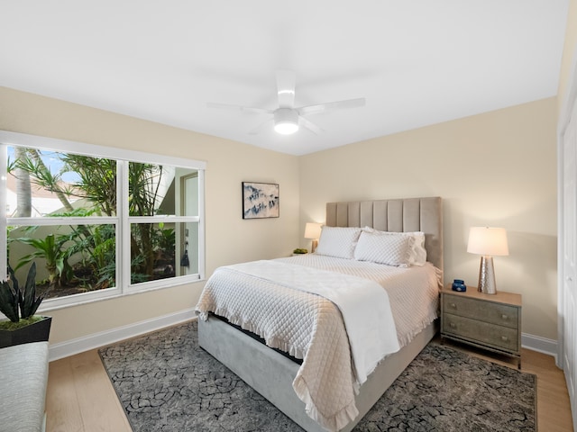 bedroom featuring hardwood / wood-style floors and ceiling fan