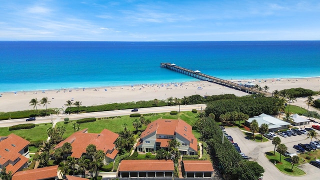 aerial view featuring a water view and a beach view