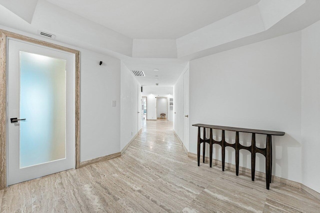 hall with light hardwood / wood-style floors