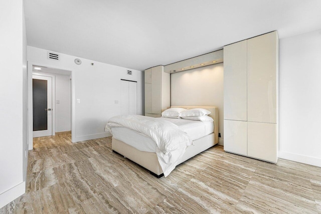 bedroom with light hardwood / wood-style floors