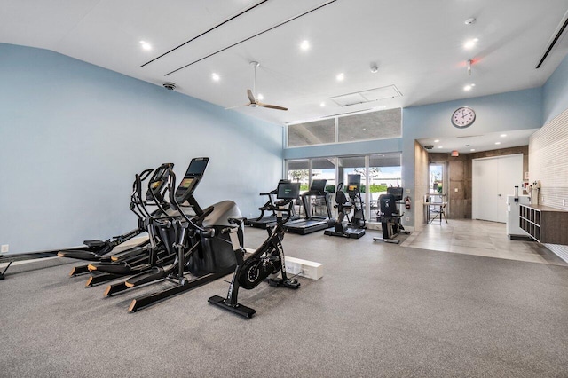 gym featuring lofted ceiling and ceiling fan