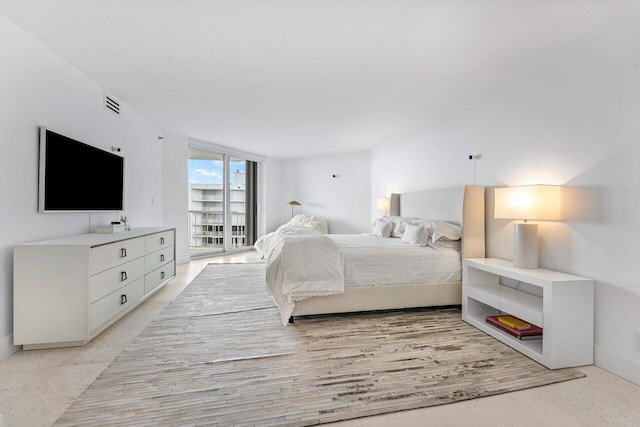 bedroom featuring light carpet