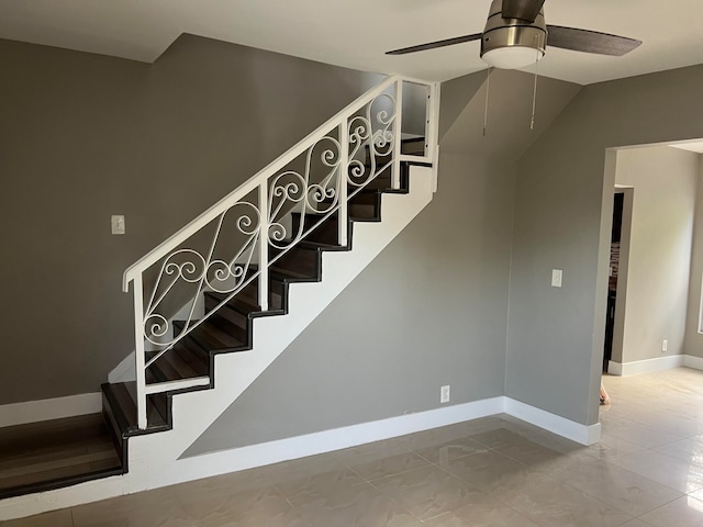 staircase with ceiling fan