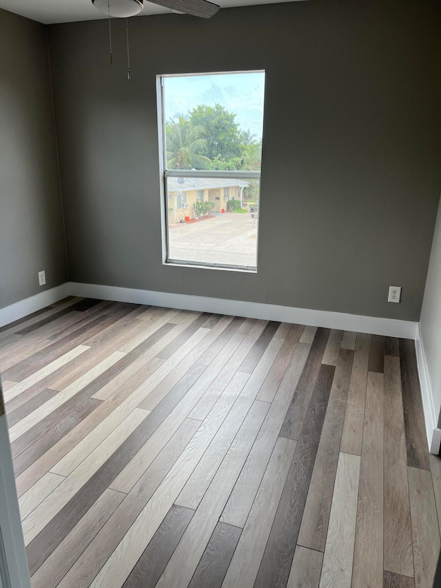 spare room with light hardwood / wood-style floors