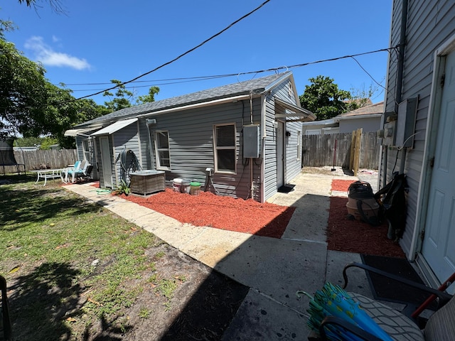 rear view of property featuring a patio