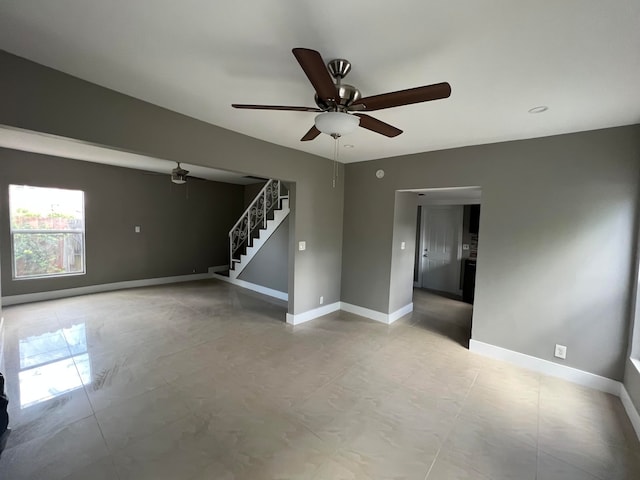 spare room with ceiling fan