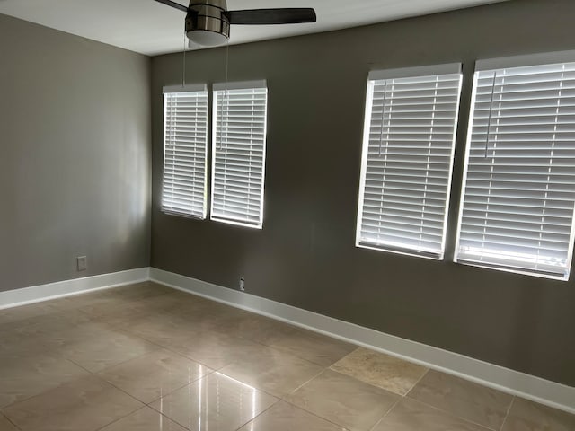 unfurnished room featuring ceiling fan