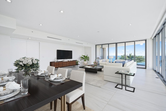 living room with floor to ceiling windows