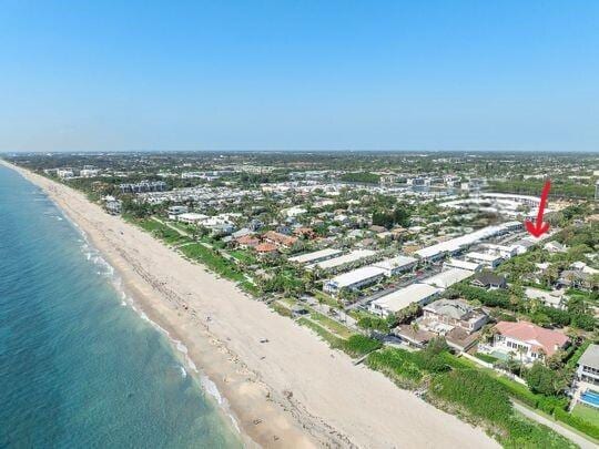 drone / aerial view with a view of the beach and a water view