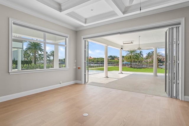 doorway featuring plenty of natural light, coffered ceiling, and beamed ceiling