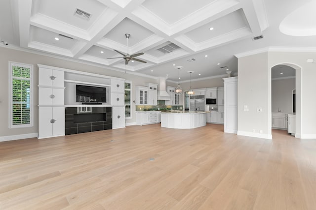 unfurnished living room featuring ceiling fan, coffered ceiling, ornamental molding, and light hardwood / wood-style flooring