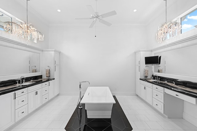 kitchen featuring sink, crown molding, and white cabinetry