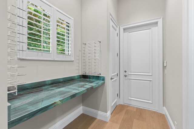 bathroom with hardwood / wood-style floors