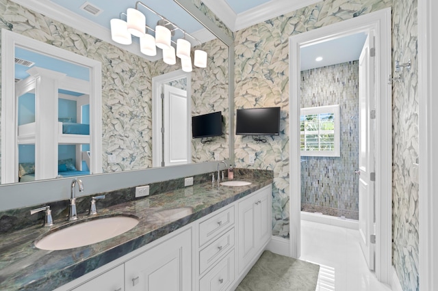 bathroom with crown molding and vanity