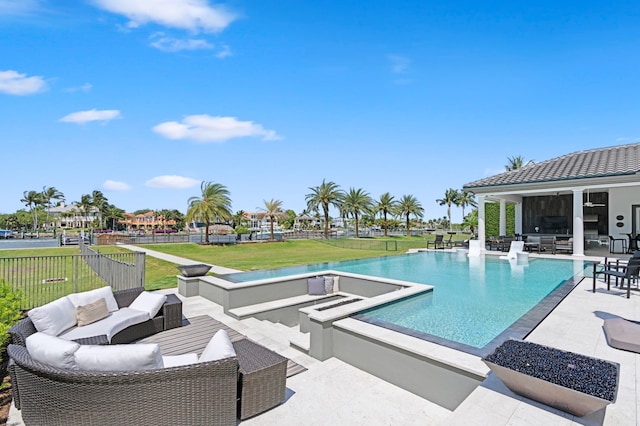 view of swimming pool featuring a lawn, an outdoor living space, and a patio area