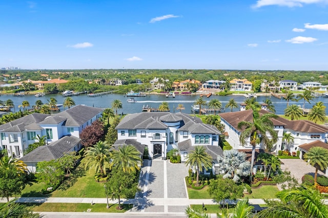 birds eye view of property with a water view