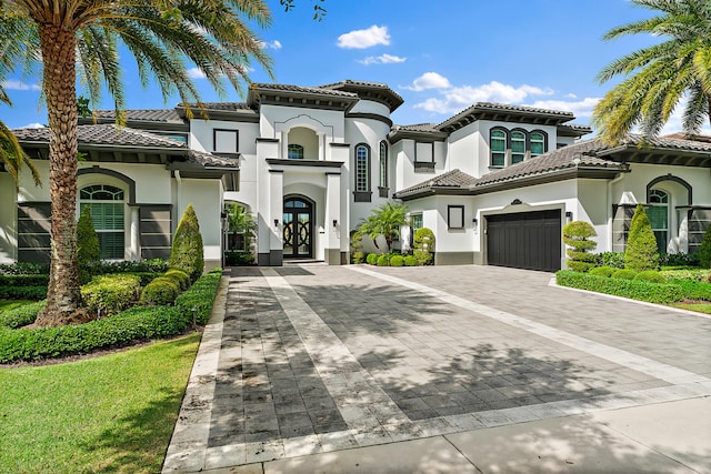 mediterranean / spanish house featuring french doors