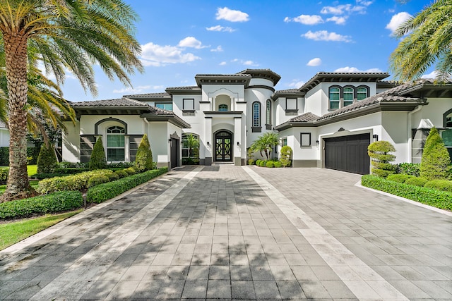 mediterranean / spanish-style house featuring a garage