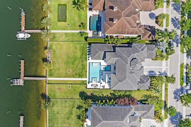 birds eye view of property featuring a water view