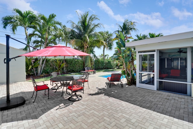 view of patio featuring ceiling fan