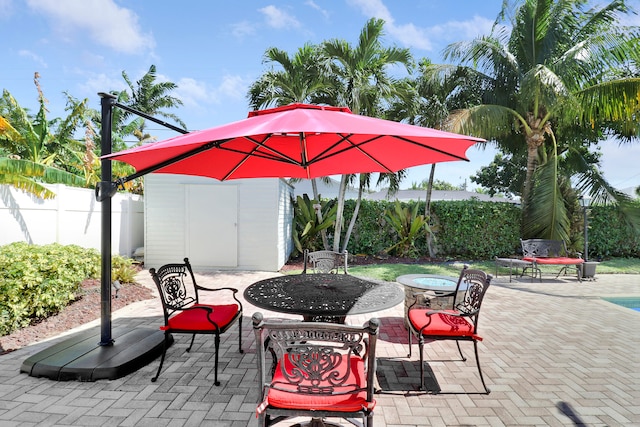 view of patio featuring a shed