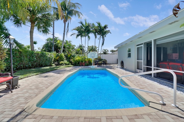 view of swimming pool with a patio area